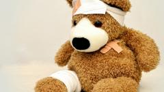 Stock images of a teddy bear wearing bandages and elastoplasts